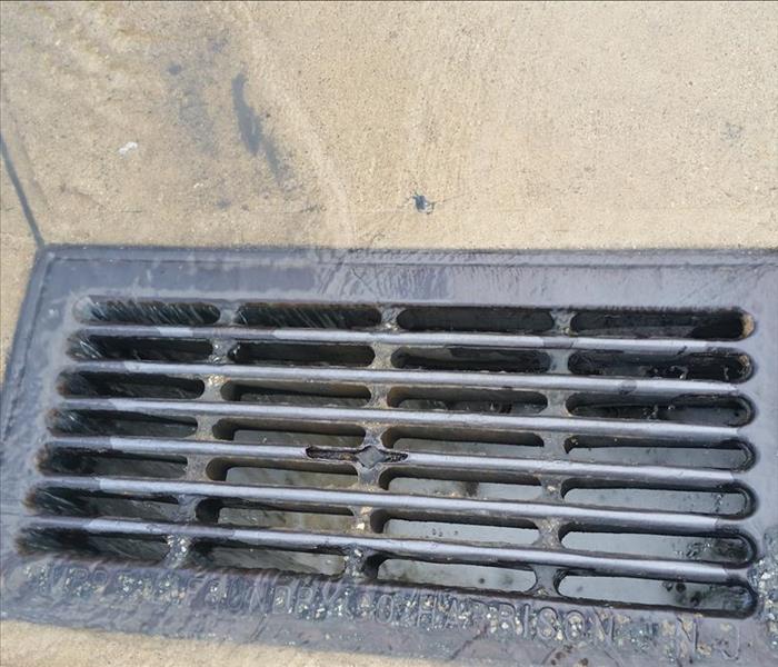 The water drained into this drain hole where we received clearance to do so.