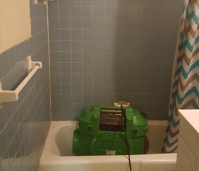 Dehumidifier set up in the bathroom to aid with drying. 